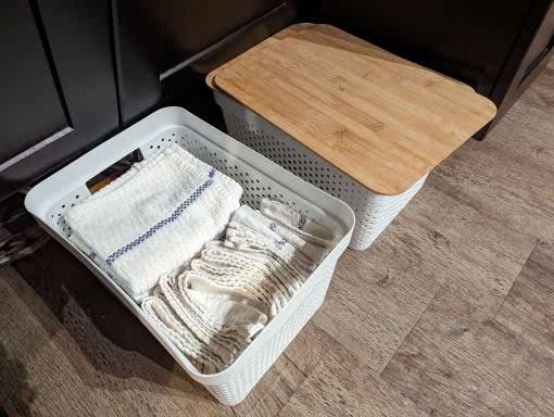 Storage for clean and dirty towels and napkins.