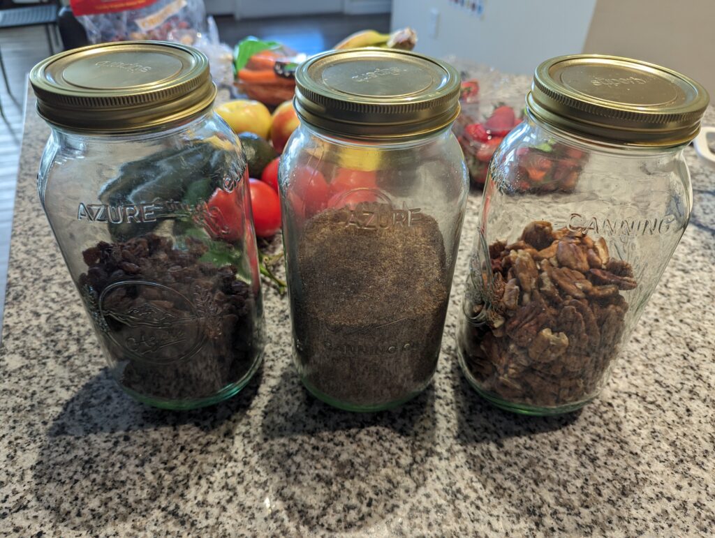 Azure canning jars and lids used for dry food storage.